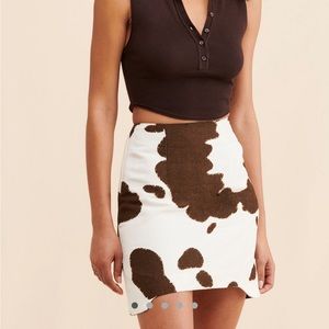 Bellevue Cow Print mini skirt, sold by Free People